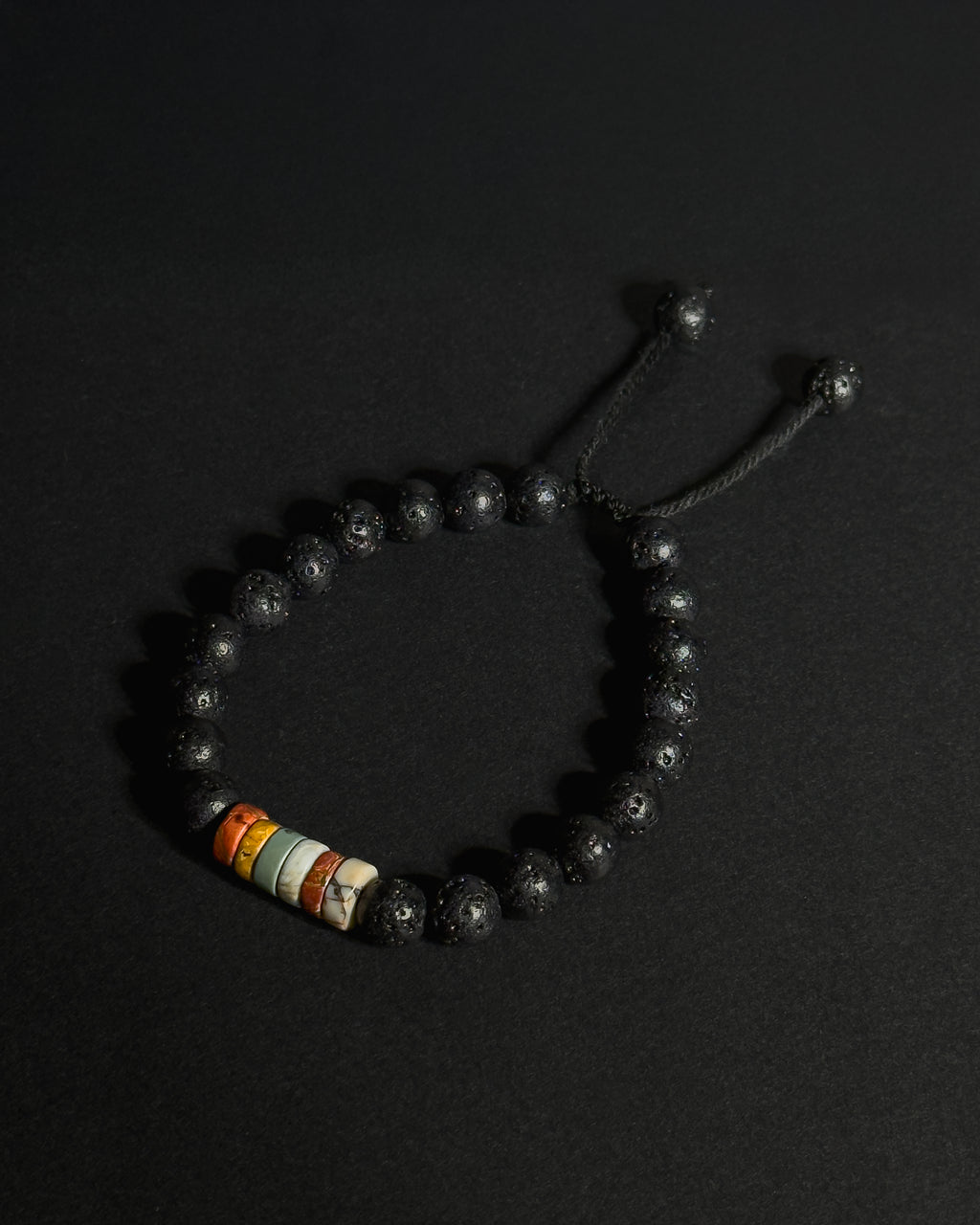 The Barrel Bracelet handcrafted with 8mm Picasso jasper wheel beads and lava stone, adjustable natural stone bracelet.