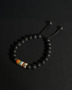 The Barrel Bracelet handcrafted with 8mm Picasso jasper wheel beads and lava stone, adjustable natural stone bracelet.
