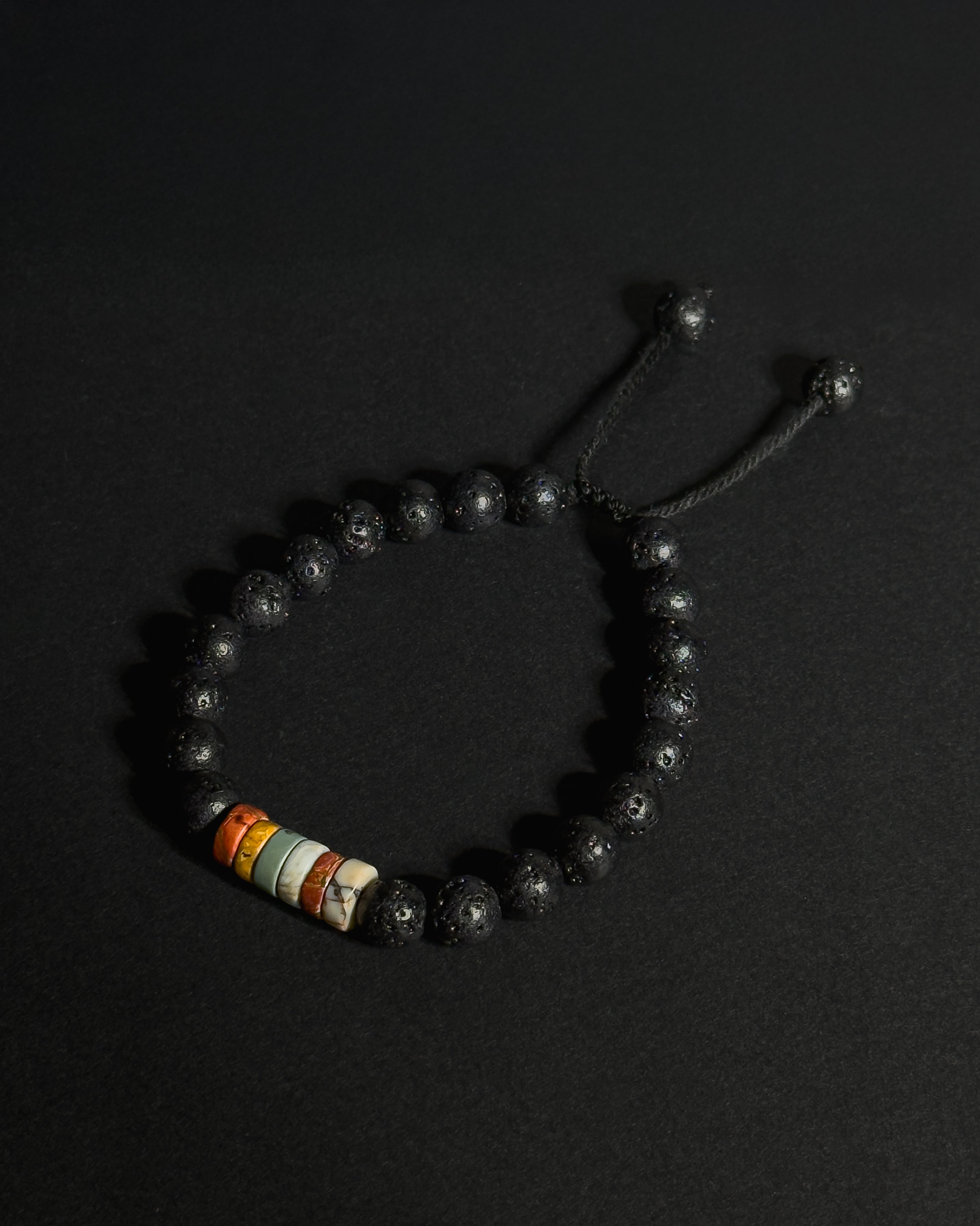 The Barrel Bracelet handcrafted with 8mm Picasso jasper wheel beads and lava stone, adjustable natural stone bracelet.