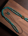 Handmade turquoise bolo inspired necklace with natural Tiger Iron centre stone, adjustable slip-knot closure, and one-of-a-kind gemstone design.