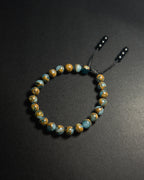 Blue Lake Bracelet featuring 8mm natural lake blue variscite beads with adjustable sliding knot closure.