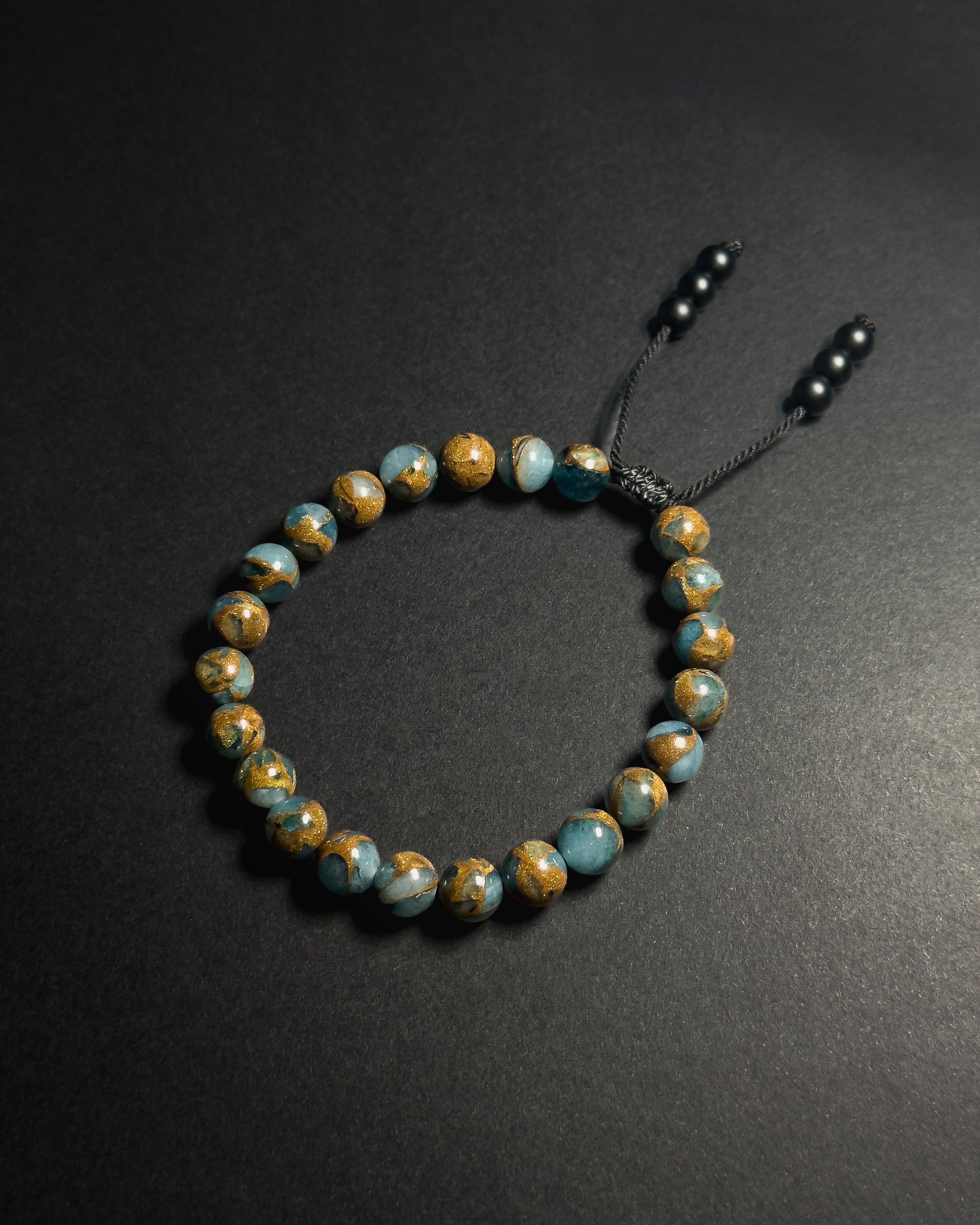 Blue Lake Bracelet featuring 8mm natural lake blue variscite beads with adjustable sliding knot closure.