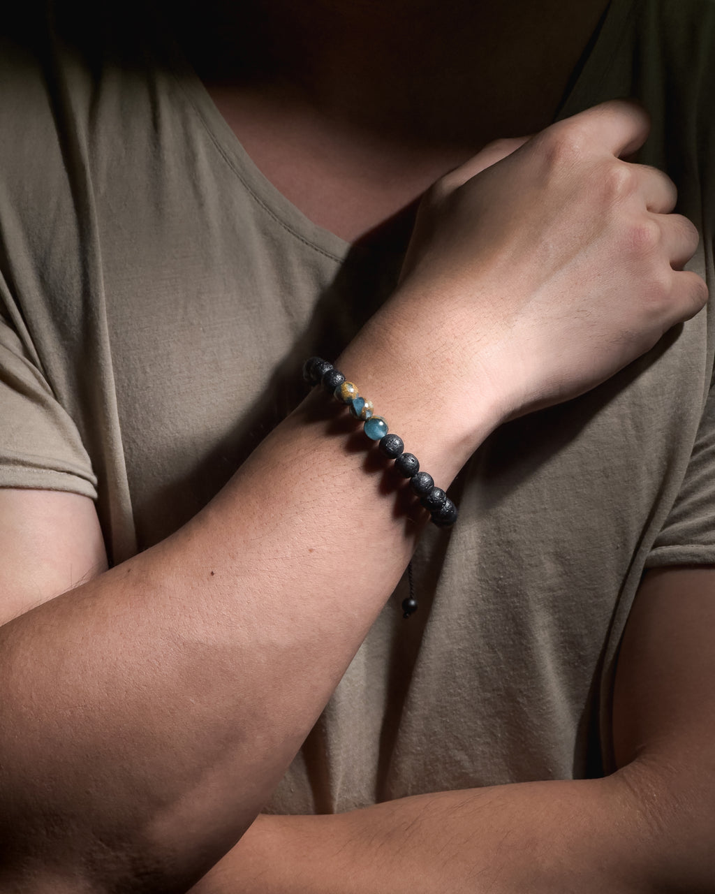 Model wearing the handmade Blue Lake Bracelet featuring 8mm lake blue variscite natural stones and adjustable sliding knot closure.