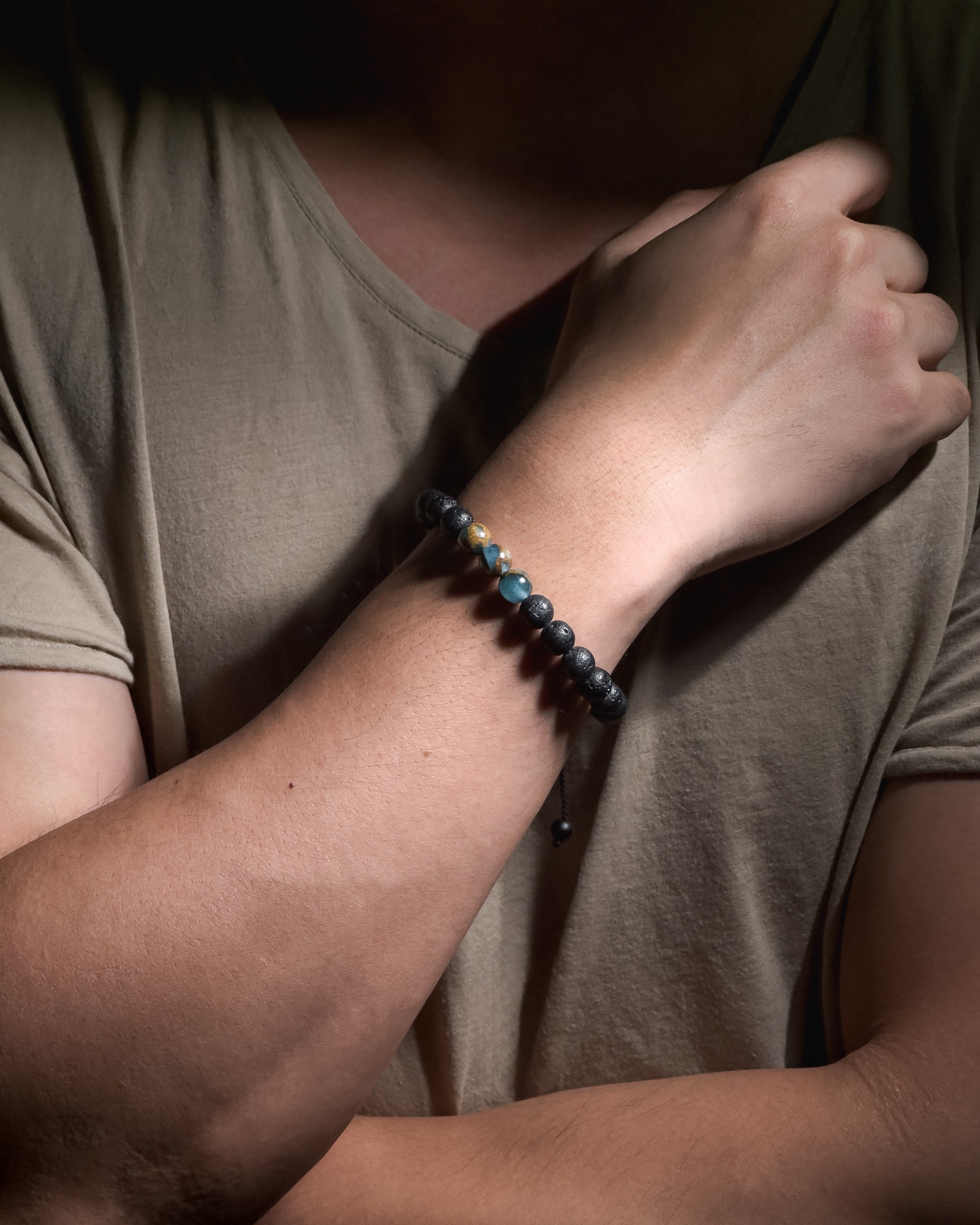 Model wearing the handmade Blue Lake Bracelet featuring 8mm lake blue variscite natural stones and adjustable sliding knot closure.