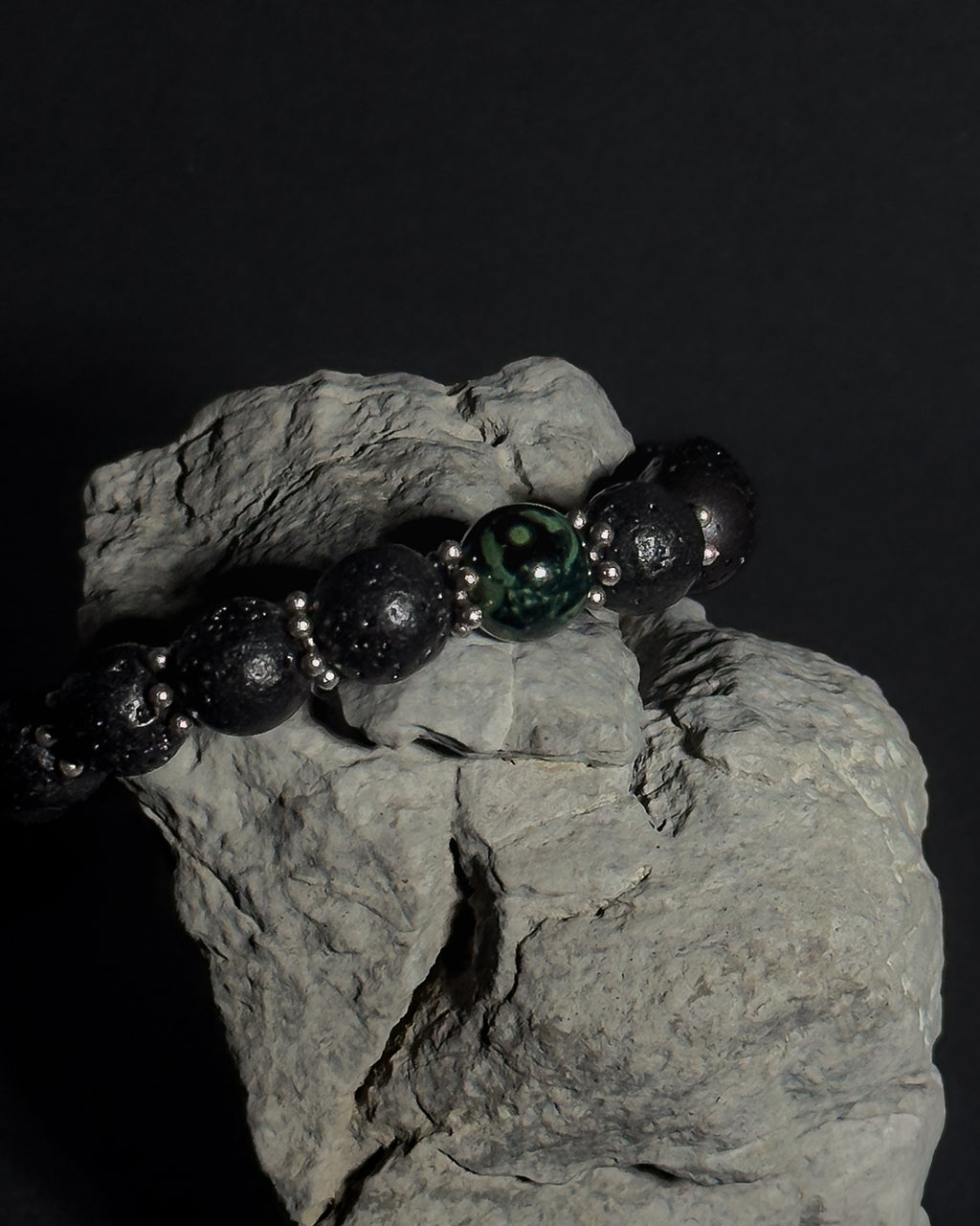 Handmade adjustable Wildstone bracelet featuring natural Kambaba jasper with lava stone, black tourmaline and stainless steel sunburst spacers.